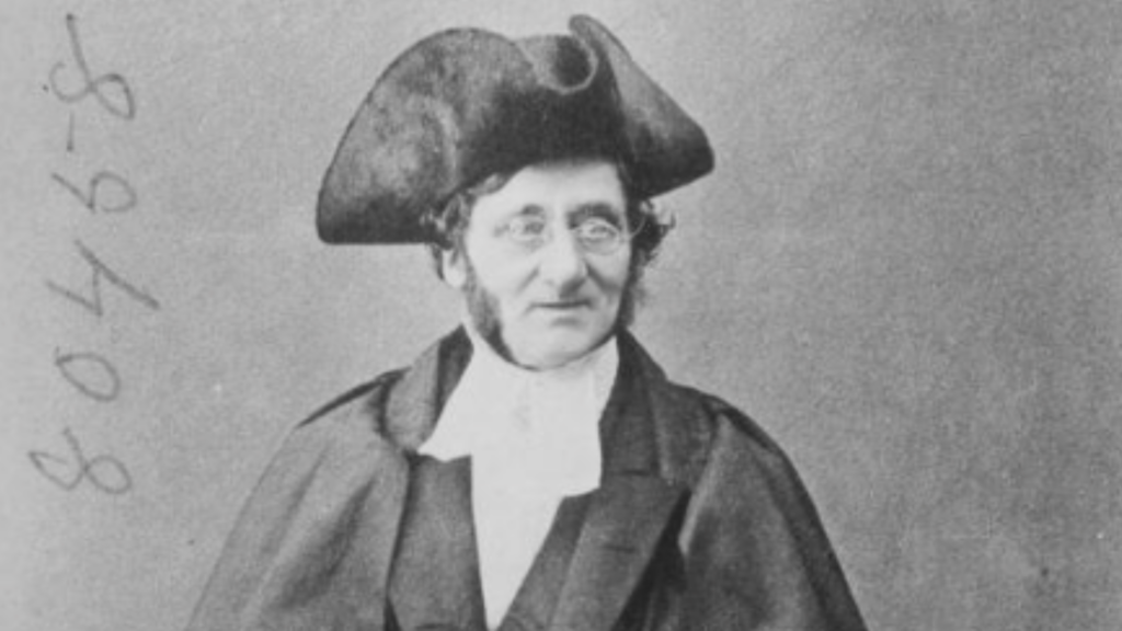 19th Century Black-and-White Photograph of a Man in a Hat and Glasses