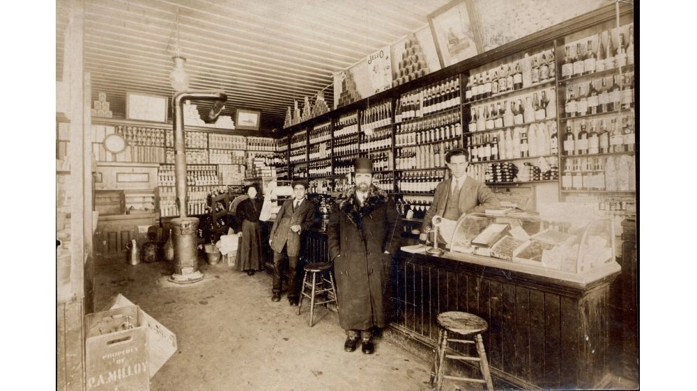 S.L. Nathanson, Sydney Nathanson, and Becky Nathanson in S.L. Nathanson Liquor Store (early 1900s)
